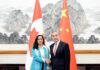 Chinese, Canadian foreign ministers pledge to improve bilateral ties